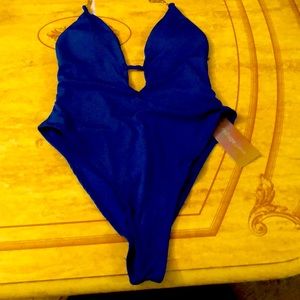 It from the brand Refuge swim. It blue and it a size large